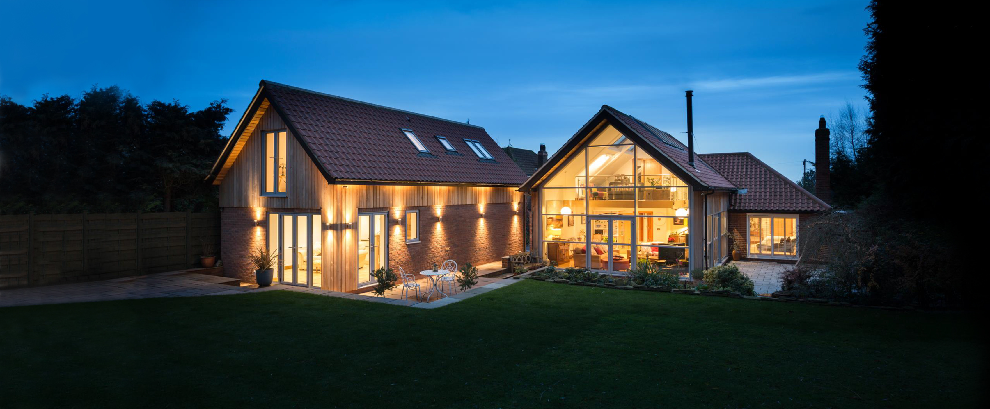 wooden cladded modern extension with attractive lighting